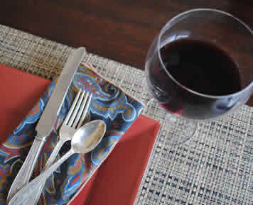 glass of red wine with place setting